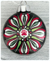 Dot Mandala Hand Painted Paw Print Christmas Ornament - 3" plastic flat bulb - red/greens/white on black glitter