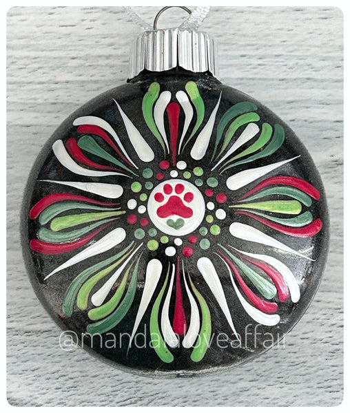 Dot Mandala Hand Painted Paw Print Christmas Ornament - 3" plastic flat bulb - red/greens/white on black glitter